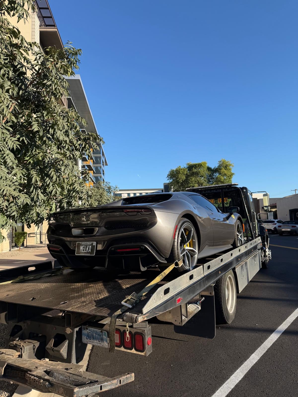 Ferrari 296 secured on the flatbed Ferrari 296 GTB loaded on JG Towing flatbed in Queens, NY.