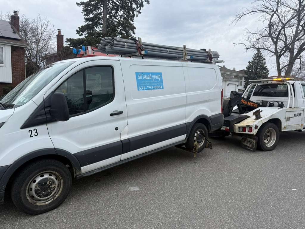 Ford Transit work van recovery White Ford Transit work van on JG Towing wheel-lift after a breakdown in Queens.